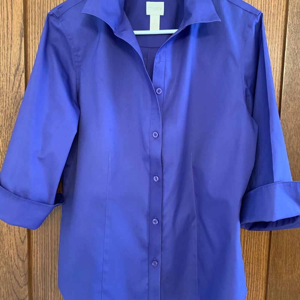 Women’s blouse size Med, in jewel tones blue.